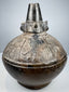 Sicán Naymlap ceramic vessel from Peru showing dark polished blackware and centuries-old surface wear.