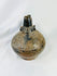 Pre-Columbian Sicán blackware ceramic vessel, upright view showing glossy surface and decorative firing patterns.