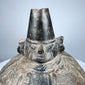 Ancient Peruvian blackware bottle from the Sicán culture with preserved burnishing and traditional vessel form.