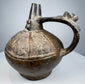 Historic Sicán pottery vessel with lustrous black ceramic surface and preserved Pre-Columbian craftsmanship.
