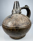 Ancient Peruvian blackware ceramic from the Lambayeque culture, dating to approximately 750–1375 AD.