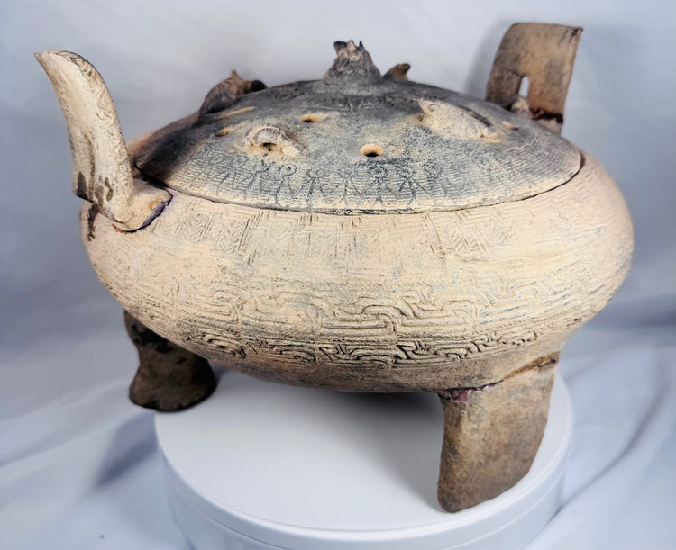 Close-up of the pierced domed lid featuring applied miniature animal figures from an ancient Chinese ritual vessel.