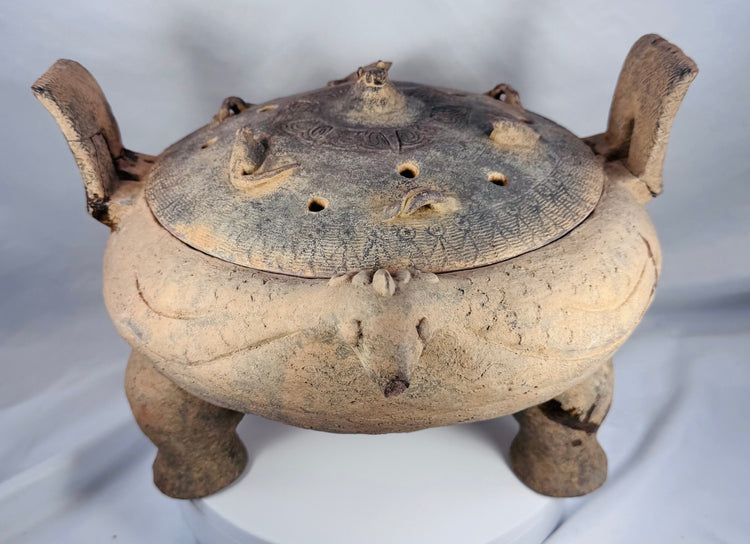 Authentic ancient Chinese terracotta ritual vessel with a removable pierced lid and tripod feet.