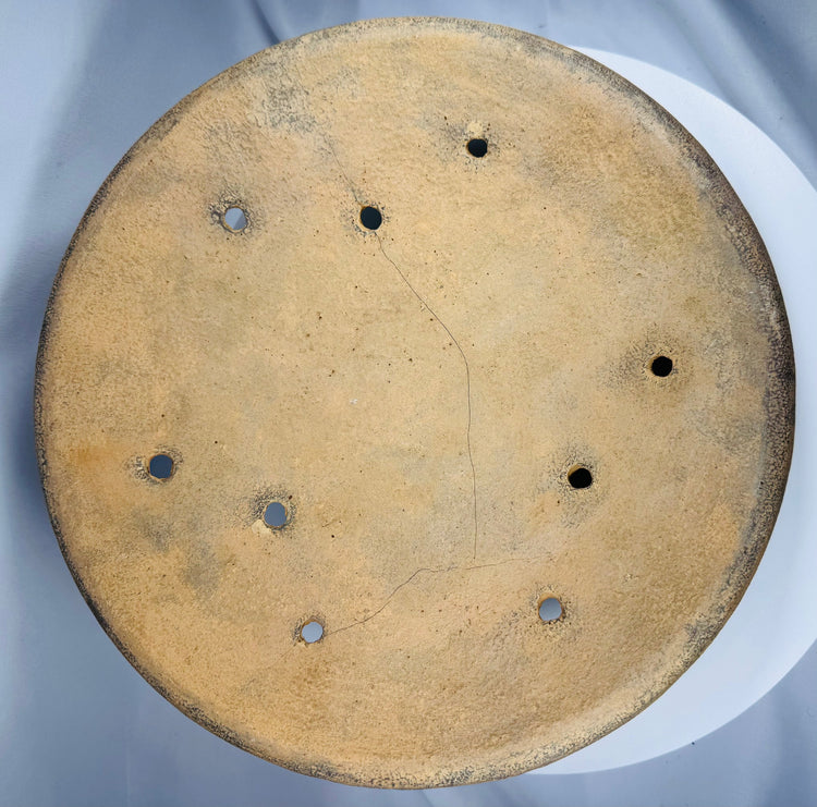 Ancient Chinese ceremonial pottery vessel decorated with incised geometric motifs and miniature animal figures.