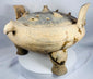 Ancient Chinese zoomorphic incense burner with three substantial tripod feet and decorative geometric ornamentation.