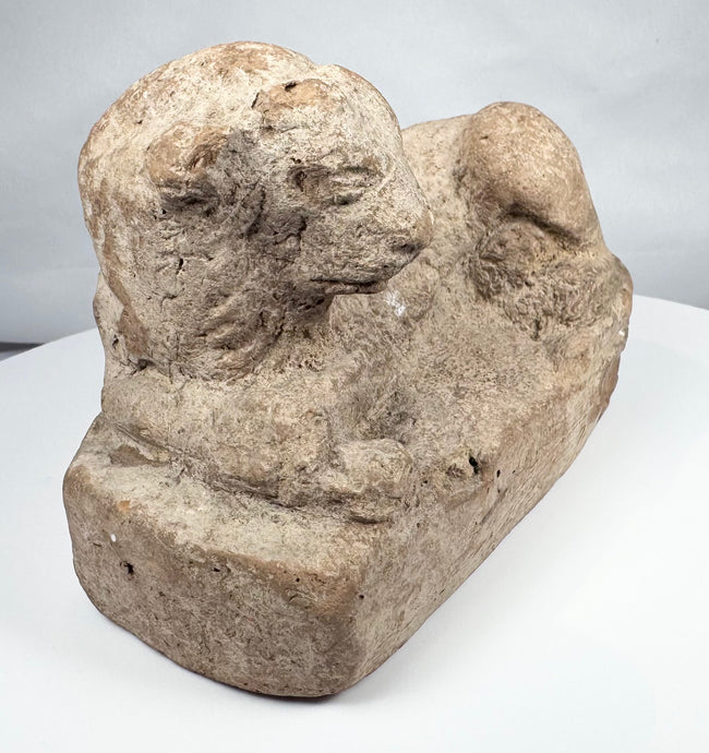 Ancient Egyptian lion sculpture in terracotta with hollow construction and integral base