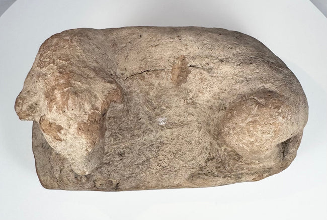 Ancient Egyptian terracotta lion artifact with almond-shaped eyes and pronounced muzzle