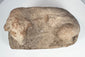 Ancient Egyptian terracotta lion artifact with almond-shaped eyes and pronounced muzzle
