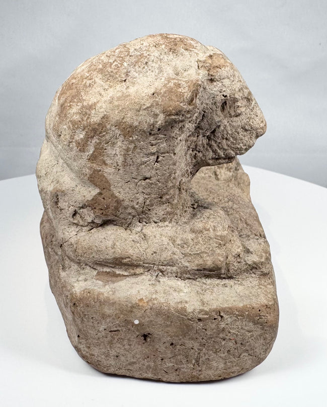 Egyptian terracotta lion votive sculpture with muscular body and stylized mane