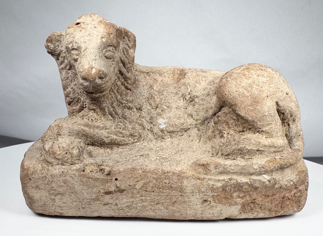 Ptolemaic Egyptian terracotta lion sculpture reclining on a rectangular plinth