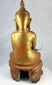 Detail of hand-carved robes on a large antique Burmese Buddhist monk statue