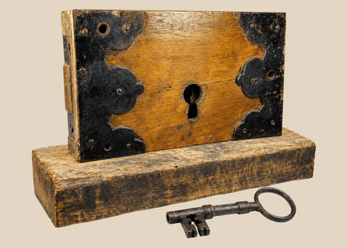 Early 19th century wooden rim lock with iron fittings and skeleton key