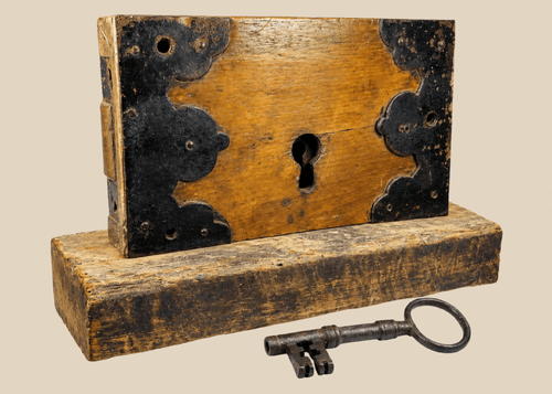 Early 19th century wooden rim lock with iron fittings and skeleton key