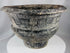 Thai Ban Chiang-inspired pottery vessel featuring textured surface patterns and sculptural form