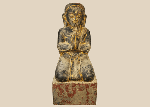 Burmese carved wood sculpture of a kneeling Buddhist devotee with hands in prayer, Mandalay period.