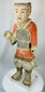 Han period terracotta warrior with expressive face and preserved paint remnants