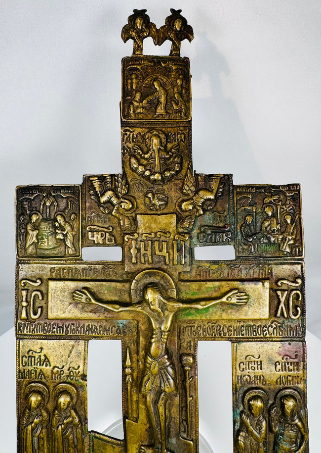 Russian Orthodox cast bronze cross with Church Slavonic inscriptions and multiple biblical scenes.