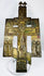 Cast bronze Russian Orthodox cross icon with multiple saintly figures and centuries-old patina.