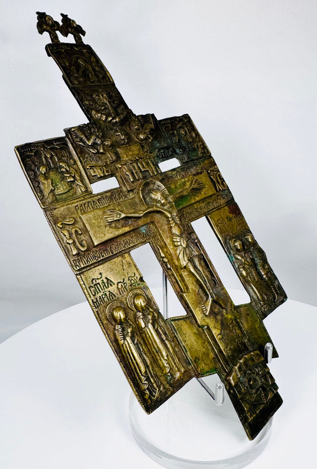 Large Russian Orthodox crucifix icon with angelic finial elements and Church Slavonic text.