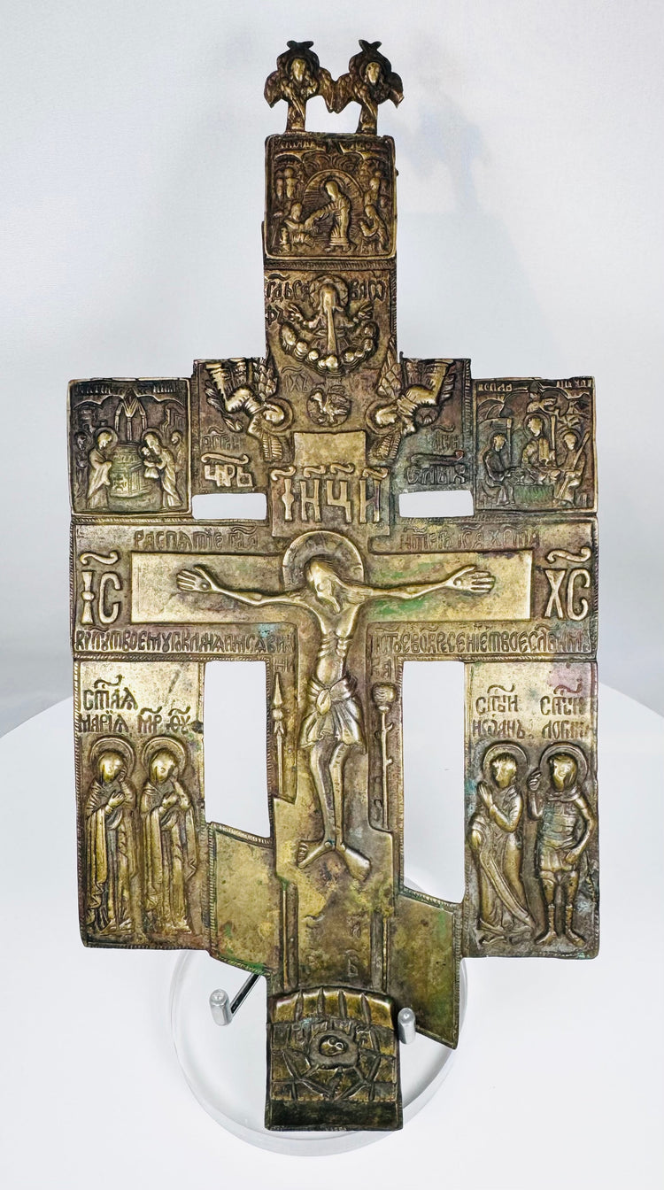 Antique Russian Orthodox bronze cross icon with high-relief crucifixion scene and religious figures, late 18th to early 19th century.