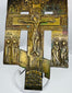 Imperial Russian bronze devotional cross displaying Christ crucified, saints, and traditional Orthodox iconography.