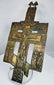 Historic Russian devotional cross featuring a central crucifixion panel and ornate religious imagery.