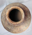 Traditional Indonesian island pottery jar with painted shoulder decoration and natural firing variations