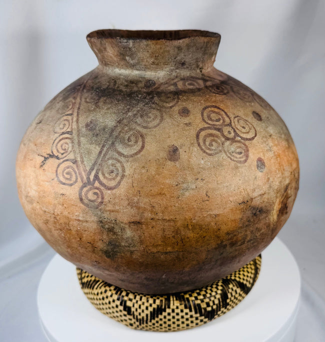 Timorese ceramic vessel displaying traditional geometric patterns and hand-built construction