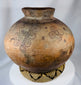 Timorese ceramic vessel displaying traditional geometric patterns and hand-built construction