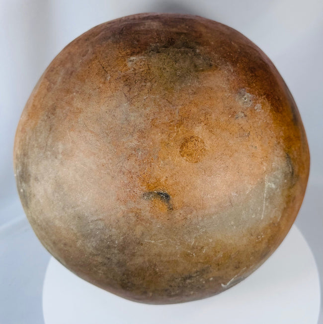 Traditional Timor Island pottery vessel featuring geometric decoration and rounded globular form