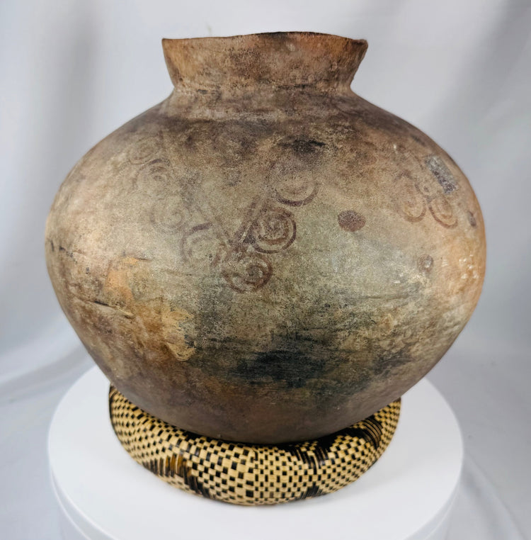 Handcrafted earthenware container from the Timor region with indigenous decorative designs