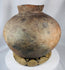 Antique Southeast Asian storage vessel with painted motifs and richly weathered ceramic surface