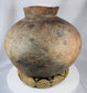 Antique Southeast Asian storage vessel with painted motifs and richly weathered ceramic surface