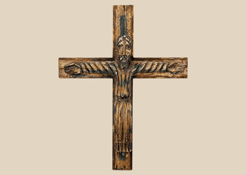 Spanish Colonial carved wooden crucifix depicting Christ with traces of polychrome paint.