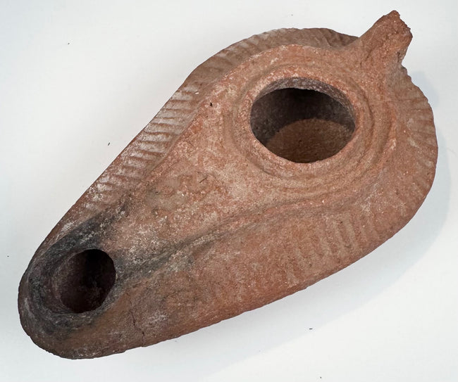 Ancient mould-made oil lamp with concentric bands and radiating shoulder grooves