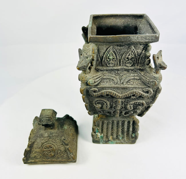 Antique Chinese archaistic bronze inspired by Western Zhou ritual forms, high relief masks and thunder-scroll motifs.