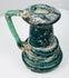 Late Roman glass vessel with thick raised trail decoration encircling the lower body