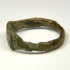 Late Roman engraved bronze ring with rectangular-to-trapezoidal face and decorated shoulders