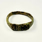 Ancient Eastern Mediterranean bronze ring with flattened engraved front and extensive age-related wear