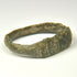 Late Roman bronze ring with letter-like engraved marks and geometric shoulder decoration