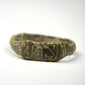 Side view of Late Roman bronze finger ring with angular shoulders and engraved linear motifs