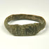 Ancient Roman bronze ring showing broad flattened bezel with incised vertical and diagonal decoration