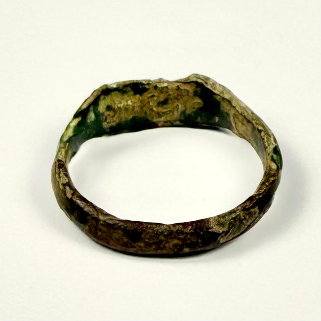 Late Roman bronze ring with broad decorated bezel and olive-green archaeological patina