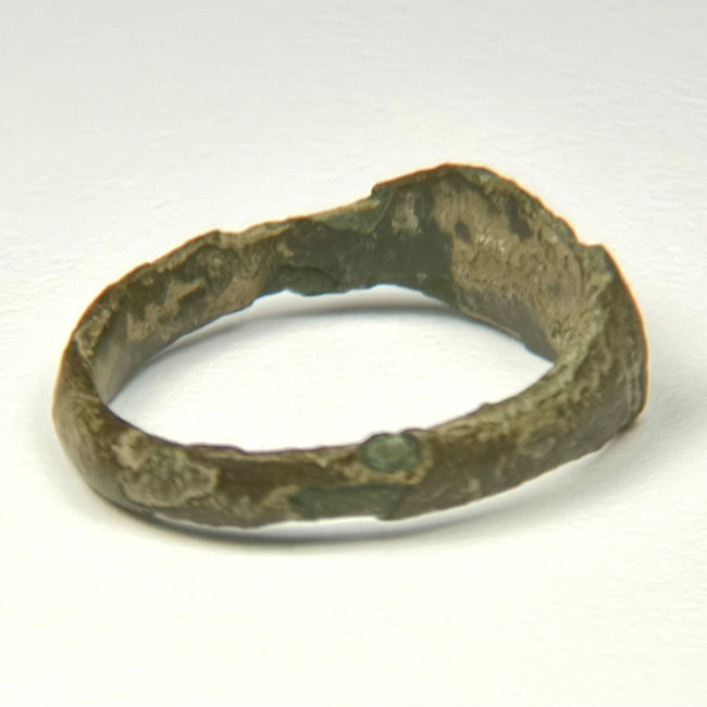 Profile view of Roman bronze ring showing solid cast construction and broad angular hoop