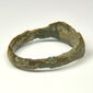Profile view of Roman bronze ring showing solid cast construction and broad angular hoop
