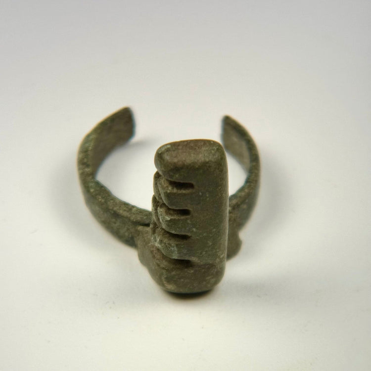 Roman Imperial bronze ring key with stepped teeth, surface mineralization, and centuries-old green-black patina
