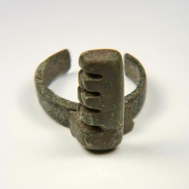 Ancient Roman bronze ring key with projecting rectangular bit and four stepped locking teeth, circa 3rd–4th century CE