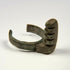 Ancient Roman copper-alloy ring key showing a substantial projecting lock mechanism and open-ended band