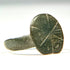 Side profile of Early Byzantine bronze ring with raised oval signet bezel and ancient surface patina