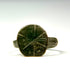 Front view of Late Roman bronze signet ring showing incised cruciform and geometric bezel decoration